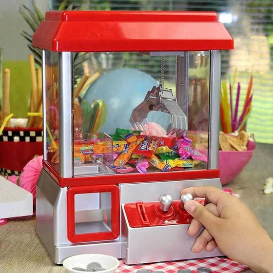 Машина за хващане на бонбони и играчки